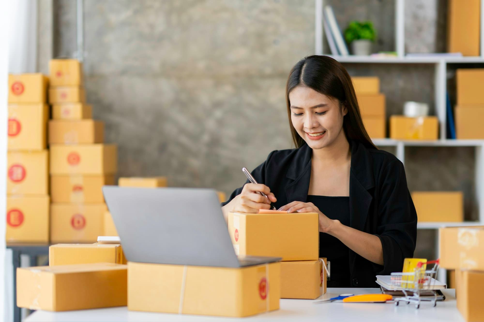 Starting Small business entrepreneur SME freelance, Portrait young woman writing the address on the