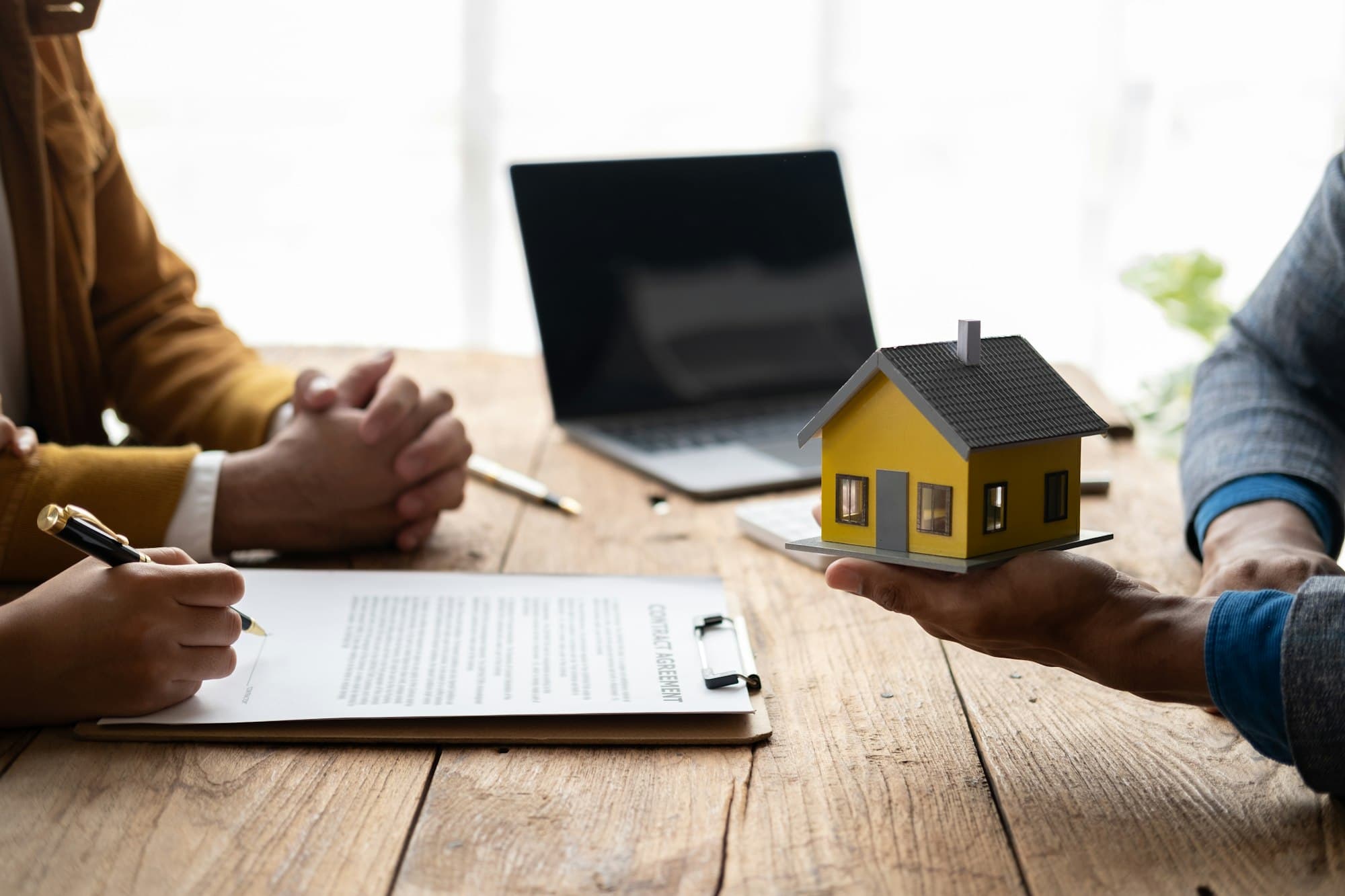 Mortgage and real estate property investment concept. Real estate agent explain terms and condition